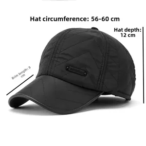 Detail view of black quilted winter baseball cap with V-stitching and metal plate