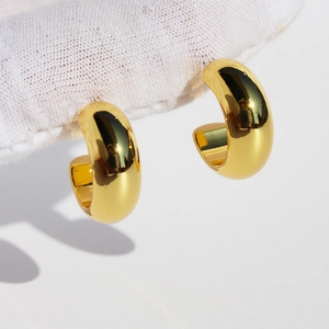 Classic thick C-shaped gold hoop earrings for daily wear with polished 18K gold finish