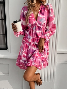 Detail showing the elegant V-neckline and pink purple tie-dye print on a mini chiffon dress