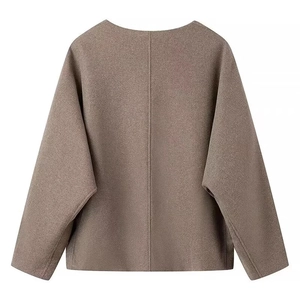 Detail view of the back seam and textured coffee brown wool-blend jacket with drop shoulders