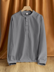 Detail of grey men's linen long sleeve shirt collar and 95% linen blended fabric texture