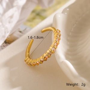 Detailed view of gold plated adjustable ring with square orange zircons and 2g weight label