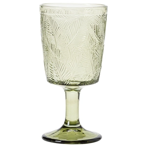 Vintage green embossed glass goblet with detailed leaf patterns on a white background