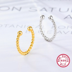Detailed view of 925 sterling silver twisted ear cuffs in gold and silver finishes