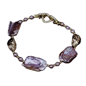 Elegant natural purple baroque pearl bracelet with gold hardware and sparkling clasp