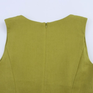 Close-up of olive green sleeveless dress back featuring a hidden zipper and woven texture