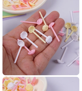 Close-up of colorful dollhouse miniature plastic spoons with hexagonal heads