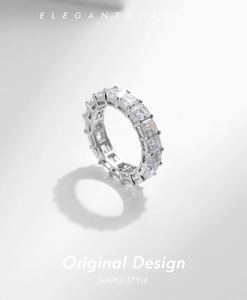 Macro view of sterling silver eternity band featuring clear rectangular cut zirconia stones