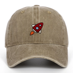 Close-up of small rocket embroidery on washed cotton twill khaki baseball cap