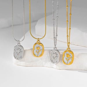 Detailed view of tulip pendants in gold and silver on snake and ball chains