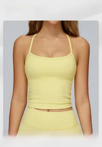 Detailed close-up of a pale yellow yoga sports vest with thin straps and racerback design