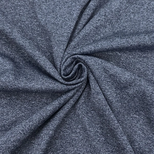 Macro shot of dark grey moisture-wicking knitted fabric with fine marl texture