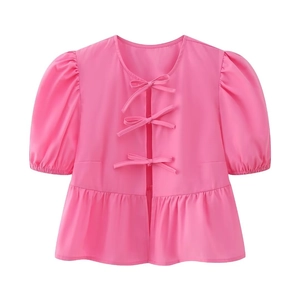 Pink short-sleeved top featuring puff sleeves and tiered ruffle hem with bow details