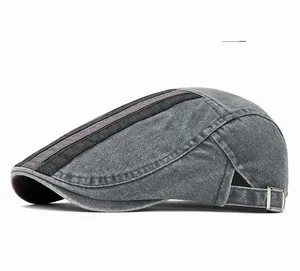 Detail of washed cotton gray flat cap featuring metal adjustment buckle and striped texture