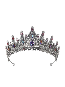 Detail of child crown with red and purple rhinestones on black metal frame