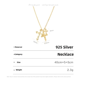 Detail of S925 silver gold-plated multi-layer necklace with triple cross pendants