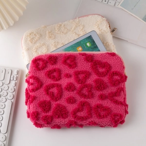 Plush heart patterned laptop sleeve for iPad and MacBook in cream and pink finishes