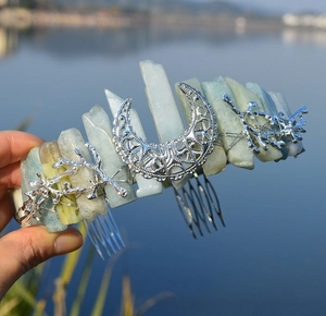Close-up of handmade crystal crown with moon ornament and raw light blue quartz stones