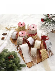 Close-up of festive Christmas ribbons with snowflake and tree patterns on wood
