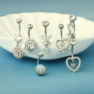 Set of surgical steel belly rings with zircon butterfly, heart and floral designs