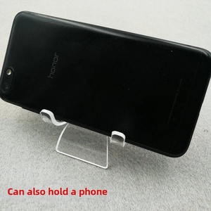 Clear acrylic display stand with U-shaped groove holding a smartphone on a grey background