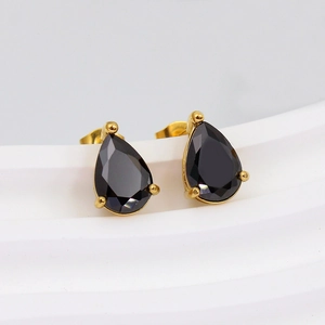 Detail of teardrop black zircon earrings with gold plating and butterfly push-back closure