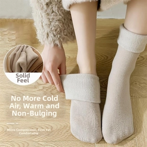 Detailed view of women's thick winter socks showing the warm fleece lining and ribbed knit