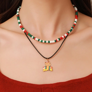 Double-layered Christmas necklace featuring festive beads and a golden reindeer pendant