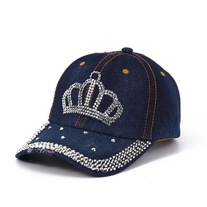Detail of blue denim baseball cap with rhinestone crown and distressed brim