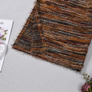 Detailed macro shot of a fuzzy multicolor striped scarf with soft mohair texture