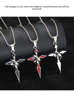 Detailed view of three stainless steel cross ring pendants in black, red, and silver finishes