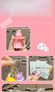 Detailed views of cute pink cartoon rabbit keychain light with durable gold metal clasp