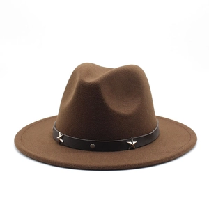 Detail of dark brown wool fedora hat featuring black leather band and silver star studs