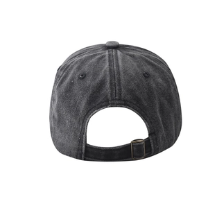 Detail view of adjustable metal buckle and washed cotton texture on baseball cap back