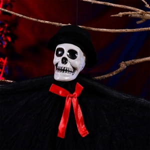 Hanging Halloween skull ghost with black top hat and red bow tie on dark background