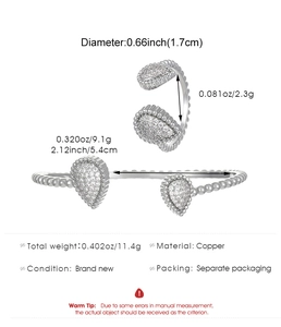 Detailed view of silver copper teardrop ring and bracelet set with stone inlay and sizing