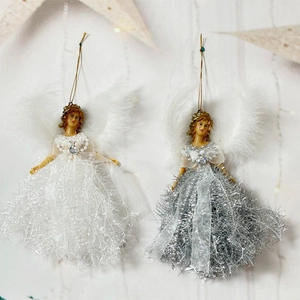 Detailed comparison of white and silver Christmas angel dolls with feather wings