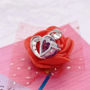 S925 sterling silver heart necklace with purple gemstone on red rose petals