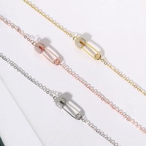 Fashionable safety pin pendant necklaces with zircon crystals in gold, silver, and rose gold