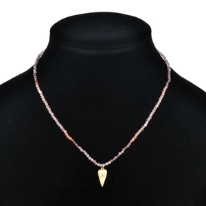 Bohemian tourmaline beaded necklace with gold Evil Eye lucky pendant on black mannequin