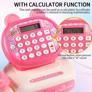 Detail of pink toy cash register with functional calculator and silicone keypad buttons