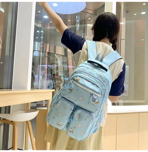 Light blue cartoon bear backpack with multi-zipper compartments for school students
