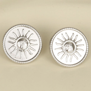 Detailed view of silver 304 stainless steel sun face relief earrings in a pair
