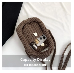 Interior capacity of brown knit crossbody bag showing storage for phone and lipstick