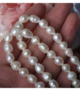 Detailed close-up of irregular 6.5-7mm baroque freshwater pearls with high luster and texture