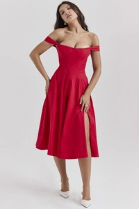 Detailed close-up of a red off-shoulder dress with a waist-cinching cut and side slit