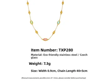 Detail of stainless steel necklace with marquise glass stones and golden oval beads