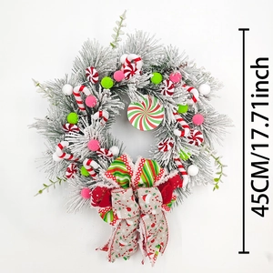 Christmas wreath with candy canes, colorful baubles and white flocking on 45cm diameter