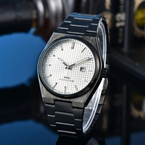 Detail view of PRX black metal watch with white waffle dial and date window