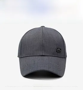 Front view of dark grey baseball cap featuring a mountain patch and curved brim detail